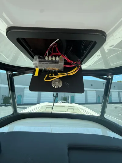  Yacht Photos Pics 2023 World Cat 325 CC boat dashboard with exposed wiring and fuse box.