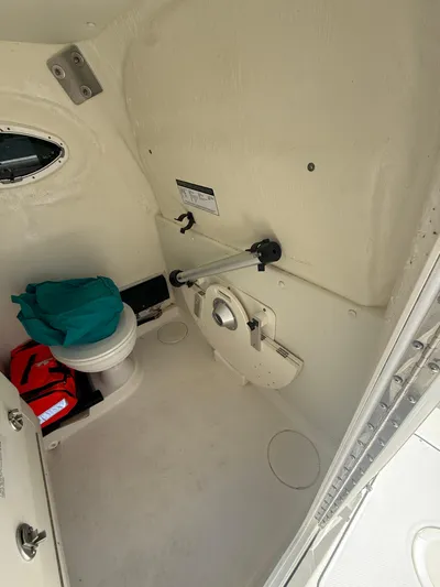  Yacht Photos Pics Interior of 2023 World Cat 325 CC boat, featuring a compact marine toilet.