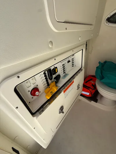  Yacht Photos Pics 2023 World Cat 325 CC boat interior with control panel and storage area.