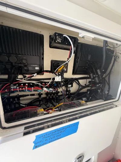  Yacht Photos Pics Electrical panel inside 2023 World Cat 325 CC boat, showcasing wiring and components.