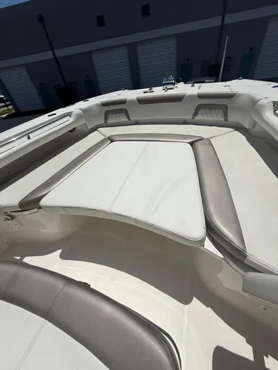  Yacht Photos Pics 2023 World Cat 325 CC boat interior with cushioned seating and storage compartments.