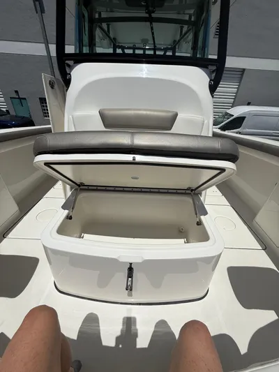  Yacht Photos Pics 2023 World Cat 325 CC boat interior with open storage compartment.