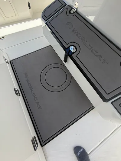  Yacht Photos Pics 2023 World Cat 325 CC boat deck with branded storage compartments.