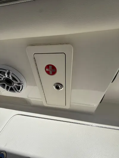  Yacht Photos Pics 2023 World Cat 325 CC boat interior with speaker and fire extinguisher compartment.