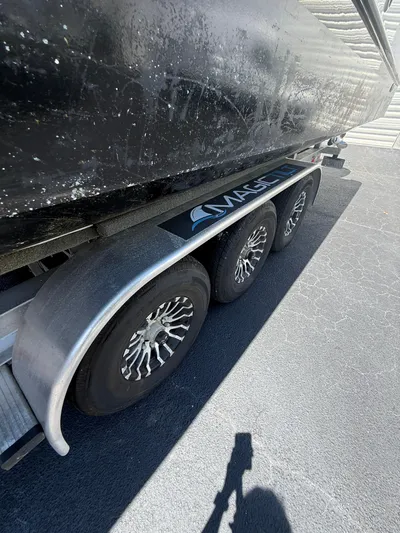  Yacht Photos Pics 2023 World Cat 325 CC on a triple-axle trailer, close-up view.