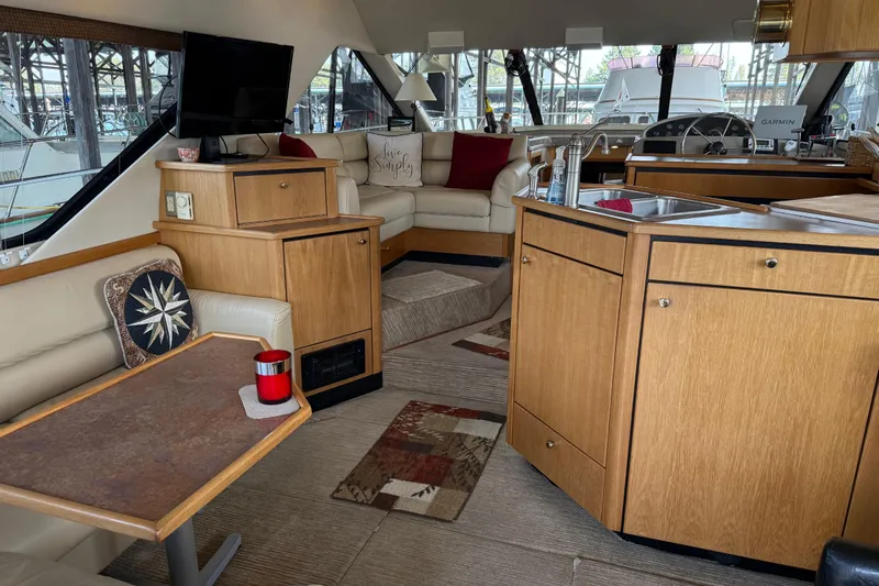  Yacht Photos Pics Interior of 1999 Bayliner 3988 Command Bridge Motoryacht with cozy seating and modern amenities.