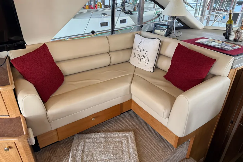  Yacht Photos Pics Luxurious interior of 1999 Bayliner 3988 Command Bridge Motoryacht with beige leather seating.