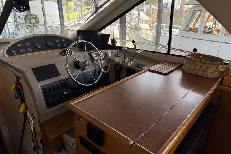  Yacht Photos Pics Interior of 1999 Bayliner 3988 Command Bridge Motoryacht with helm and control panel.