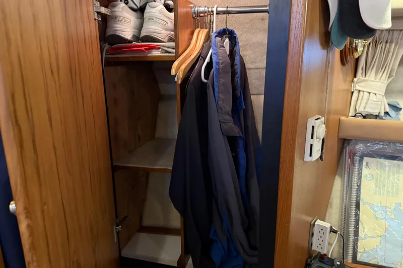 Yacht Photos Pics Closet interior on 1999 Bayliner 3988 Command Bridge Motoryacht with clothes and shoes.