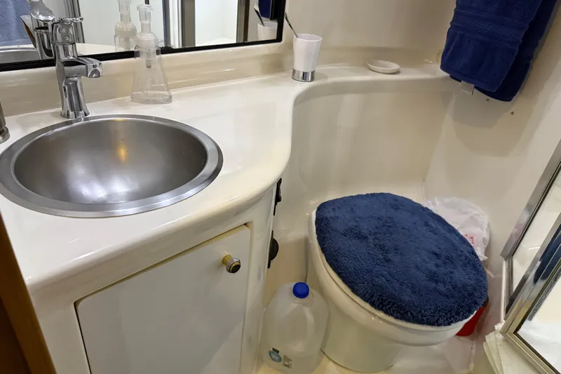  Yacht Photos Pics Bathroom interior of 1999 Bayliner 3988 Command Bridge Motoryacht with sink and toilet.