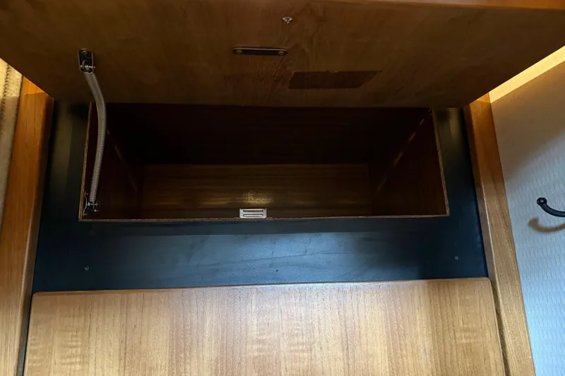  Yacht Photos Pics Open wooden storage compartment on 1999 Bayliner 3988 Command Bridge Motoryacht.