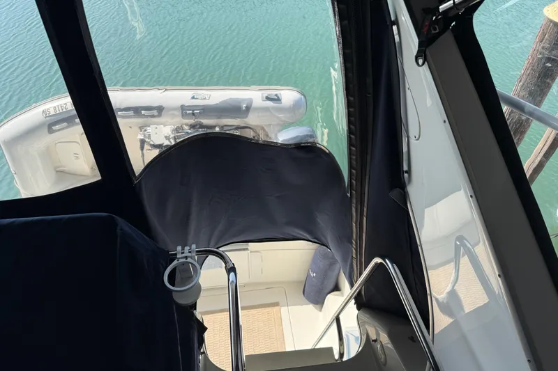  Yacht Photos Pics 1999 Bayliner 3988 Command Bridge Motoryacht interior view with water backdrop.