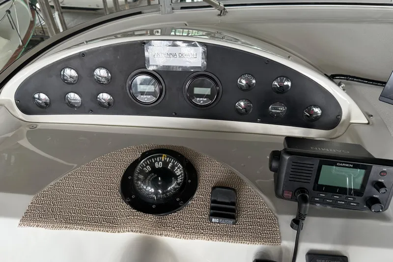  Yacht Photos Pics 1999 Bayliner 3988 Command Bridge Motoryacht dashboard with gauges, compass, and Garmin device.