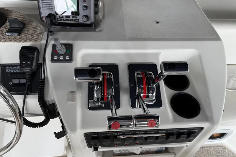  Yacht Photos Pics 1999 Bayliner 3988 Command Bridge Motoryacht control panel with throttle levers and navigation equipment.