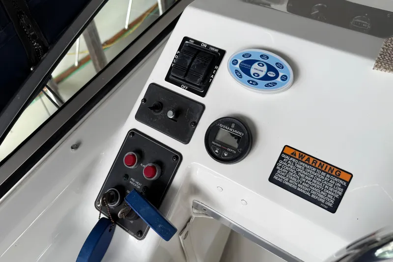  Yacht Photos Pics 1999 Bayliner 3988 Command Bridge Motoryacht control panel with switches and warning label.