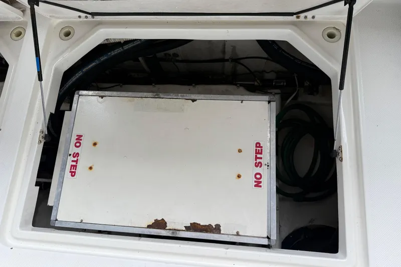  Yacht Photos Pics 1999 Bayliner 3988 Command Bridge Motoryacht engine compartment with "No Step" warning.