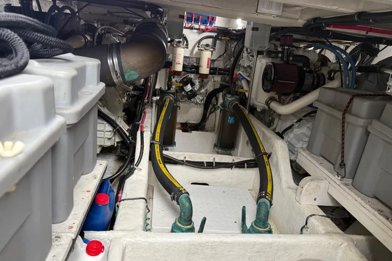  Yacht Photos Pics Engine room of 1999 Bayliner 3988 Command Bridge Motoryacht, showcasing mechanical components.