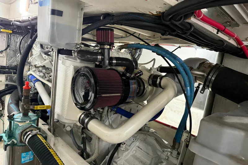  Yacht Photos Pics Engine room of 1999 Bayliner 3988 Command Bridge Motoryacht with visible components and wiring.