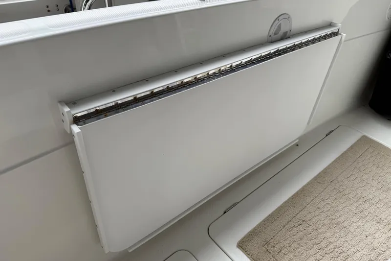  Yacht Photos Pics 1999 Bayliner 3988 Command Bridge Motoryacht interior detail with foldable table and carpeted floor.