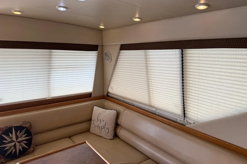  Yacht Photos Pics Interior of 1999 Bayliner 3988 Command Bridge Motoryacht with cozy seating and decorative pillows.