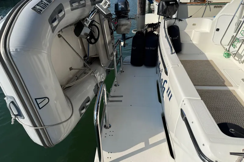  Yacht Photos Pics 1999 Bayliner 3988 Command Bridge Motoryacht with inflatable dinghy on deck.