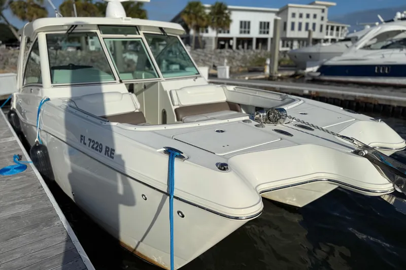  Yacht Photos Pics 2016 World Cat 320 DC boat docked at marina, side view.
