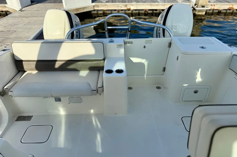  Yacht Photos Pics 2016 World Cat 320 DC boat interior with seating and storage compartments.