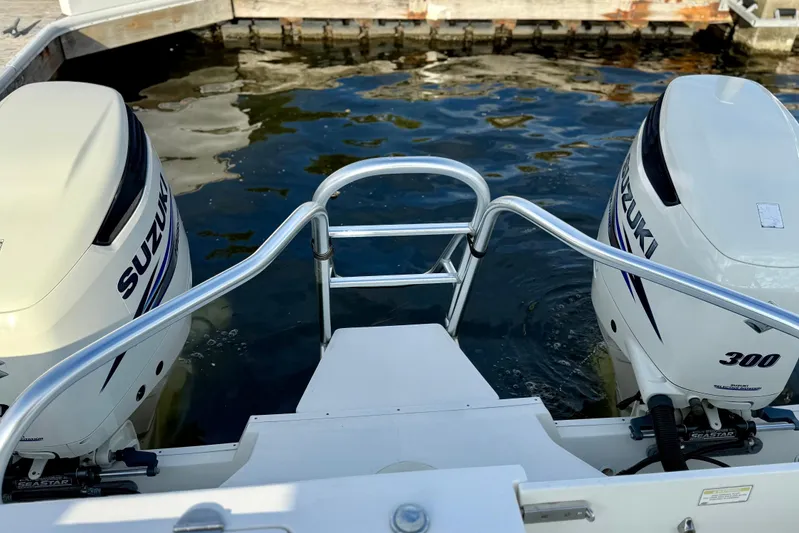 Yacht Photos Pics 2016 World Cat 320 DC boat with twin Suzuki 300 engines at dock.