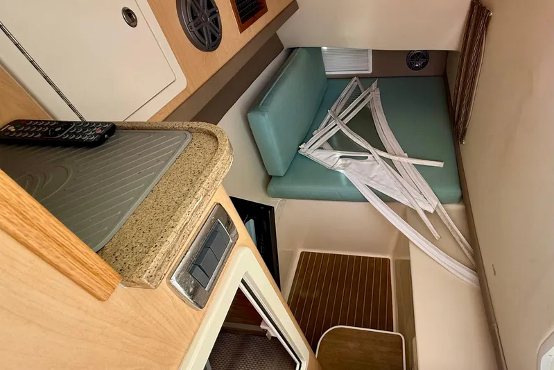  Yacht Photos Pics Interior of 2016 World Cat 320 DC boat with seating and countertop.