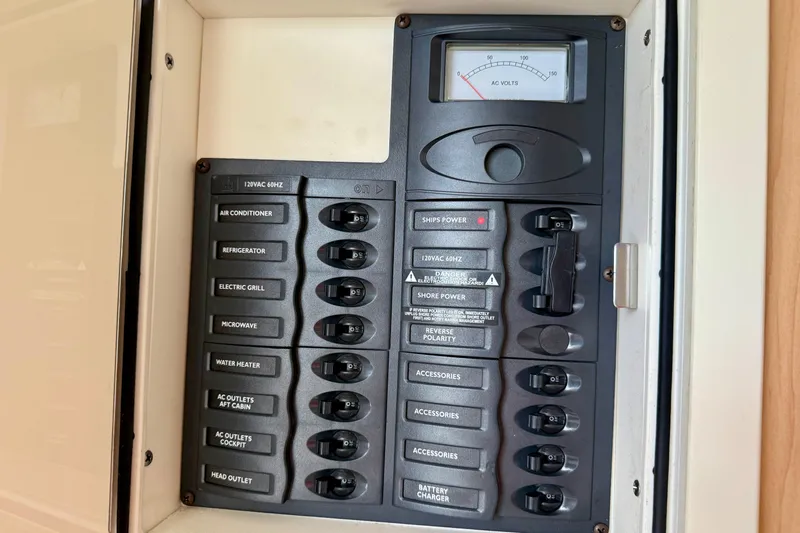  Yacht Photos Pics Electrical panel of 2016 World Cat 320 DC boat with labeled switches and voltmeter.