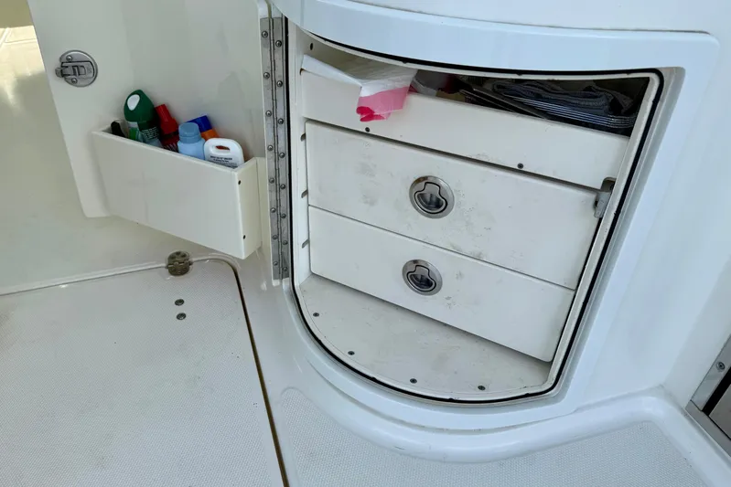  Yacht Photos Pics Storage compartment on a 2016 World Cat 320 DC boat with drawers and supplies.