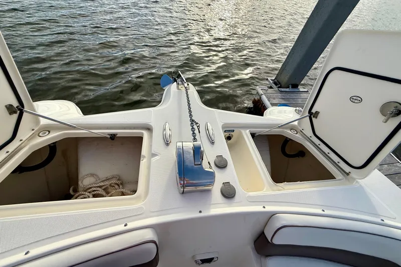  Yacht Photos Pics 2016 World Cat 320 DC boat deck with open storage compartments and anchor chain.