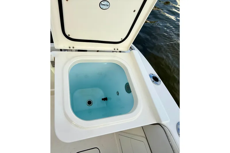  Yacht Photos Pics Open livewell on 2016 World Cat 320 DC boat, near water.