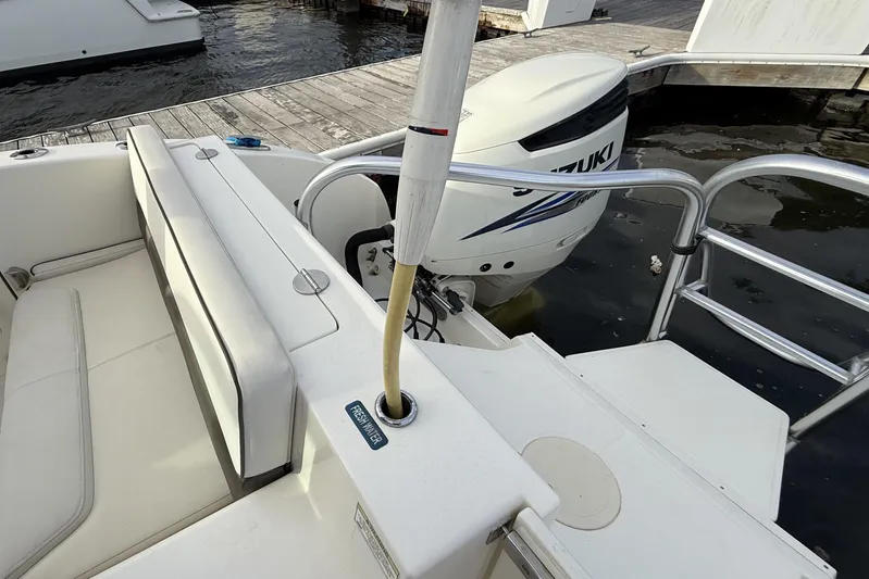  Yacht Photos Pics 2016 World Cat 320 DC boat with Suzuki outboard engine at dockside.