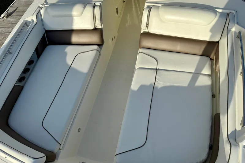  Yacht Photos Pics 2016 World Cat 320 DC boat interior with white and brown cushioned seating.