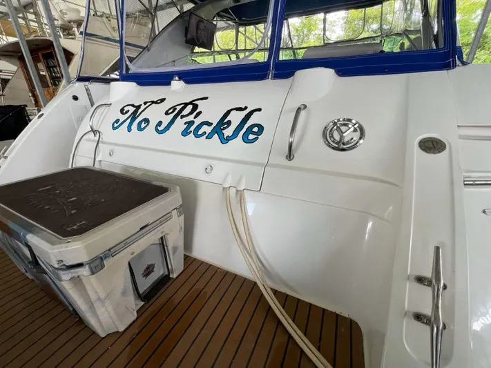  Yacht Photos Pics 2000 Cruisers Yachts 4270 Express with "No Pickle" name on the stern, docked.
