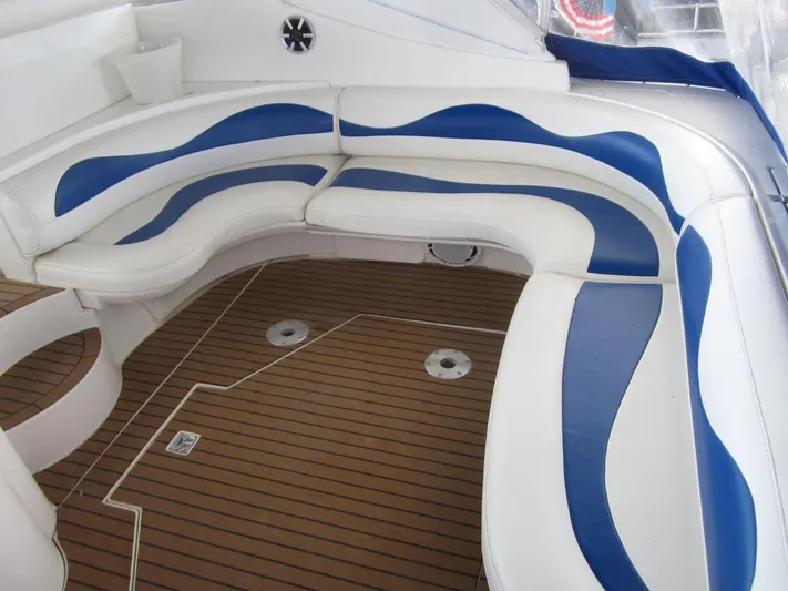  Yacht Photos Pics Luxurious seating area on 2000 Cruisers Yachts 4270 Express with blue and white upholstery.