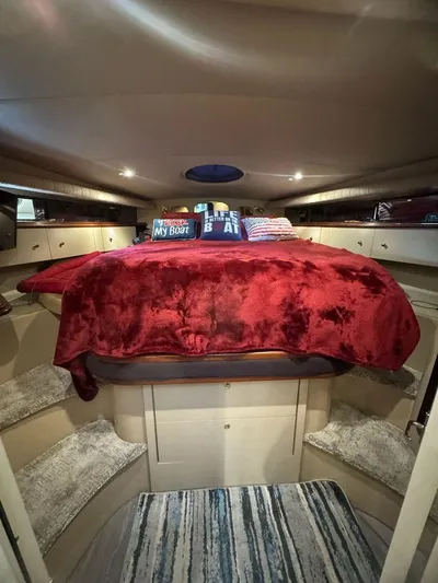  Yacht Photos Pics Luxurious 2000 Cruisers Yachts 4270 Express cabin with plush red bedding.