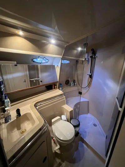  Yacht Photos Pics Bathroom interior of 2000 Cruisers Yachts 4270 Express with shower and sink.