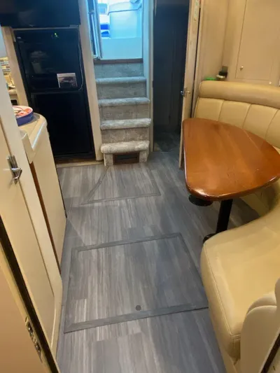  Yacht Photos Pics 2000 Cruisers Yachts 4270 Express interior with dining area and stairs.