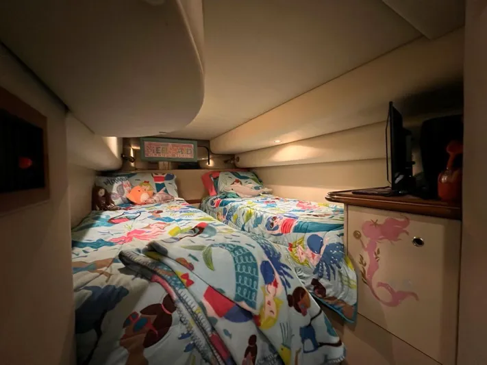  Yacht Photos Pics Cozy twin beds in 2000 Cruisers Yachts 4270 Express cabin with colorful bedding.