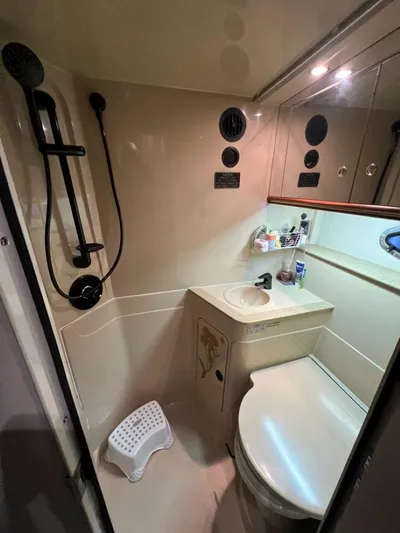 Yacht Photos Pics Bathroom interior of 2000 Cruisers Yachts 4270 Express with shower and sink.