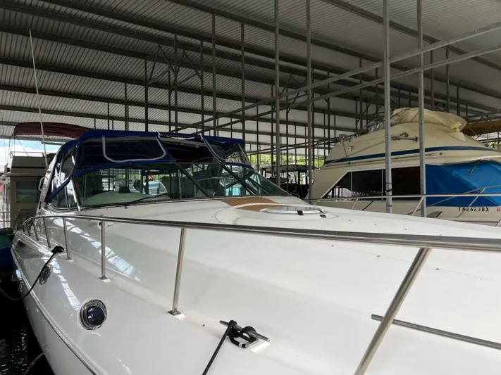  Yacht Photos Pics 2000 Cruisers Yachts 4270 Express docked in a covered marina.