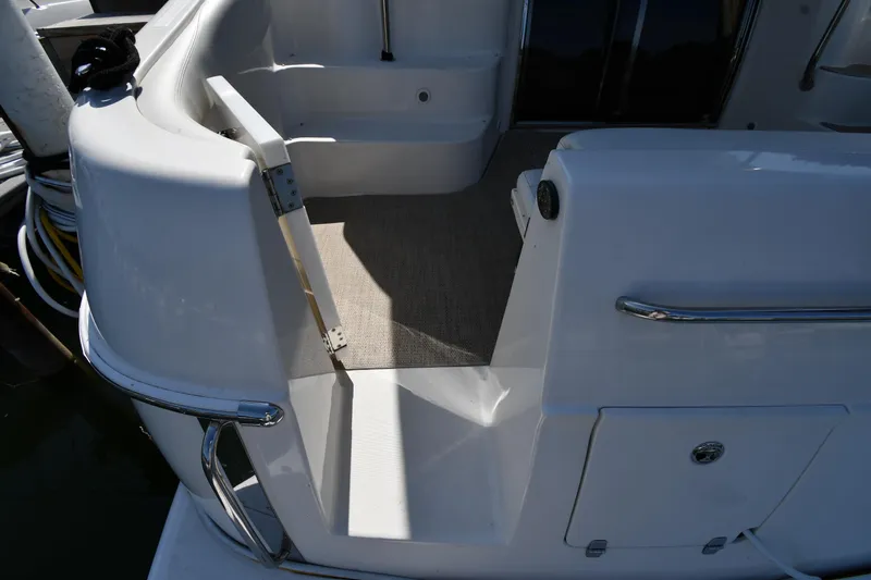  Yacht Photos Pics 2003 Regal Commodore 3880 yacht deck with open hatch and seating area.