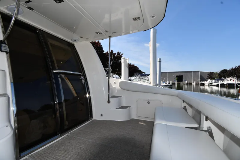  Yacht Photos Pics 2003 Regal Commodore 3880 yacht interior with seating, docked at marina.