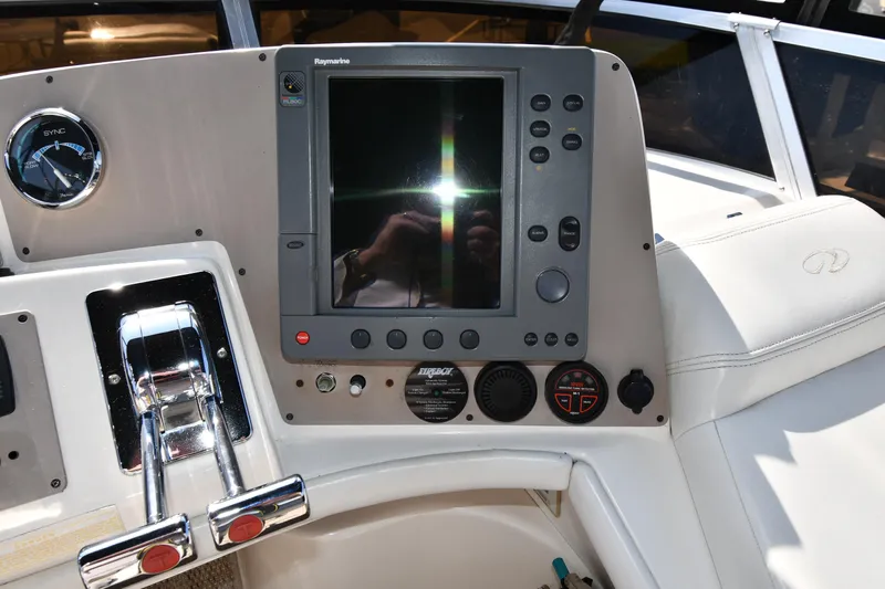  Yacht Photos Pics Control panel of a 2003 Regal Commodore 3880 boat with navigation equipment.
