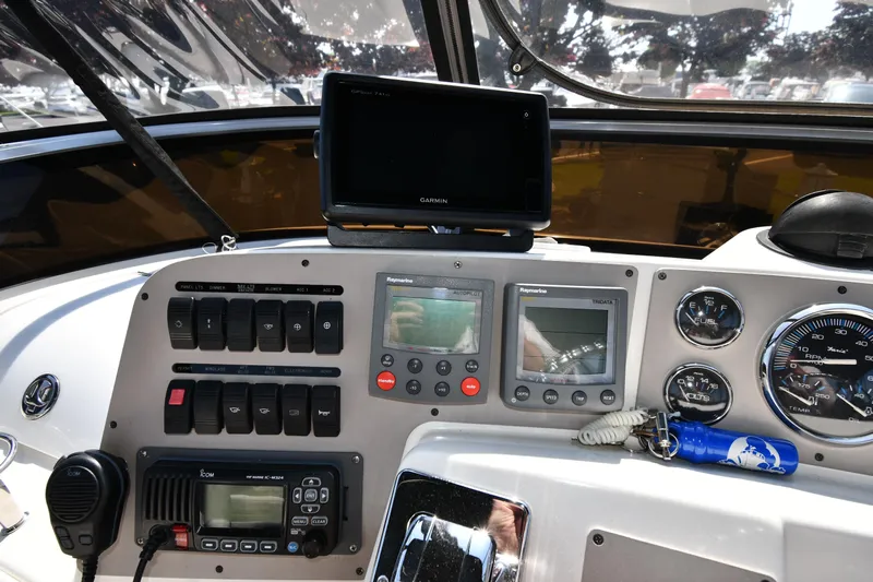  Yacht Photos Pics Control panel of a 2003 Regal Commodore 3880 boat with navigation and communication equipment.