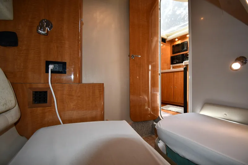  Yacht Photos Pics Interior of 2003 Regal Commodore 3880 yacht, featuring wood paneling and modern amenities.