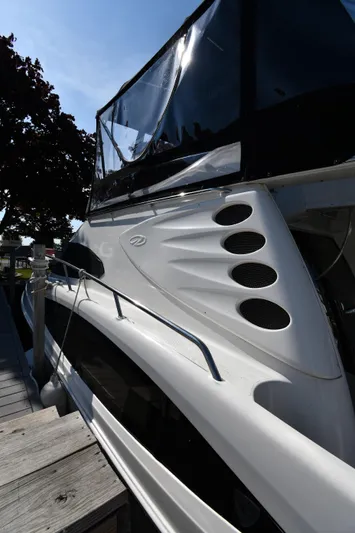  Yacht Photos Pics 2003 Regal Commodore 3880 yacht docked, showcasing sleek design and modern features.