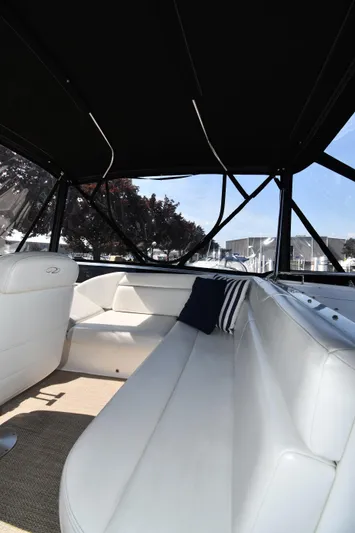  Yacht Photos Pics Interior of 2003 Regal Commodore 3880 yacht with white seating and canopy.